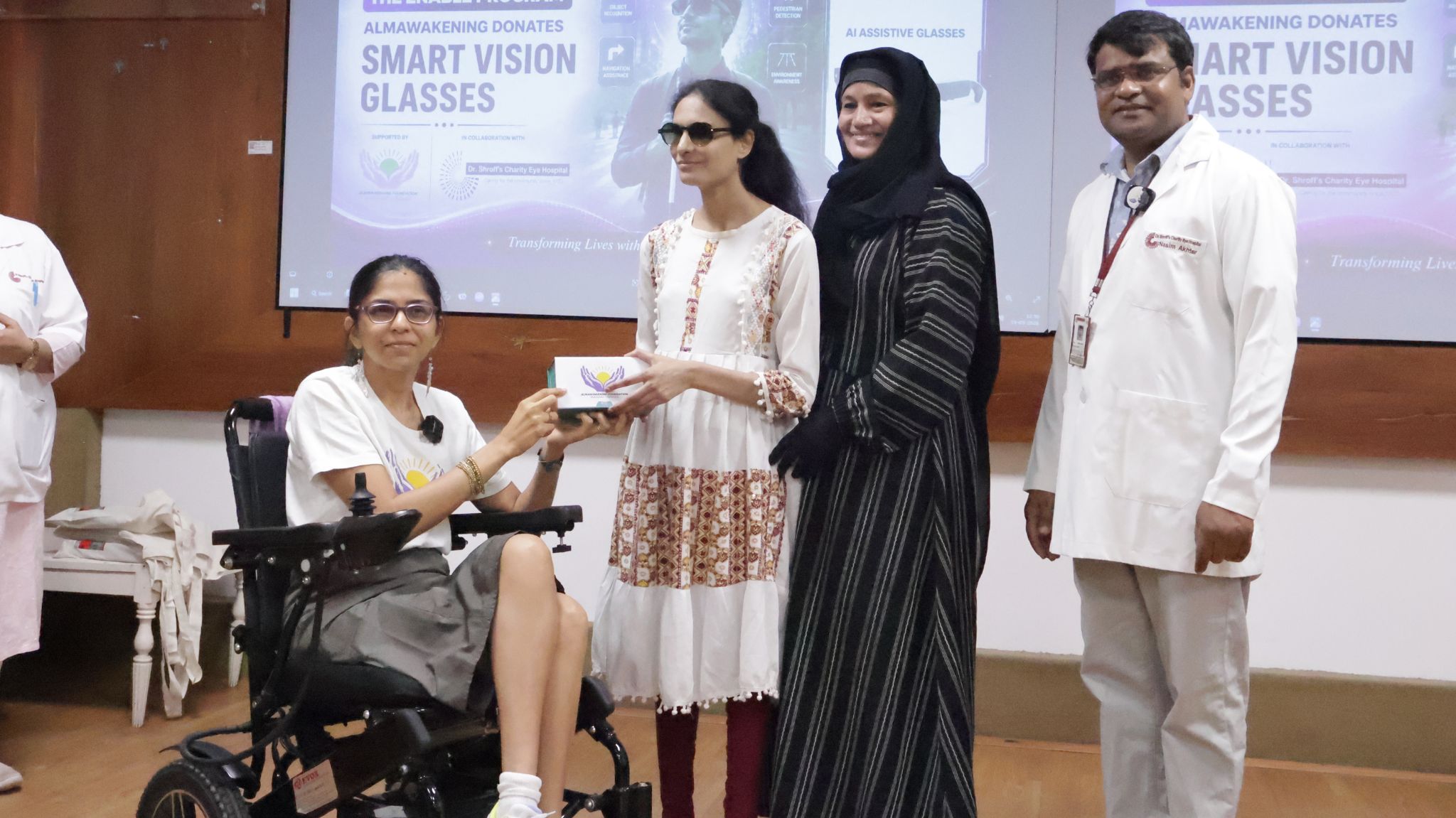 Visual impaired girl receiving the ai assistive glasses from Alma